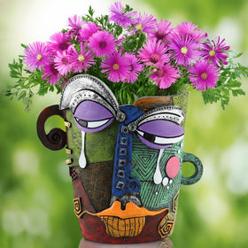 BJVF head planter with drainage hole promotes healthy plant roots outdoors.