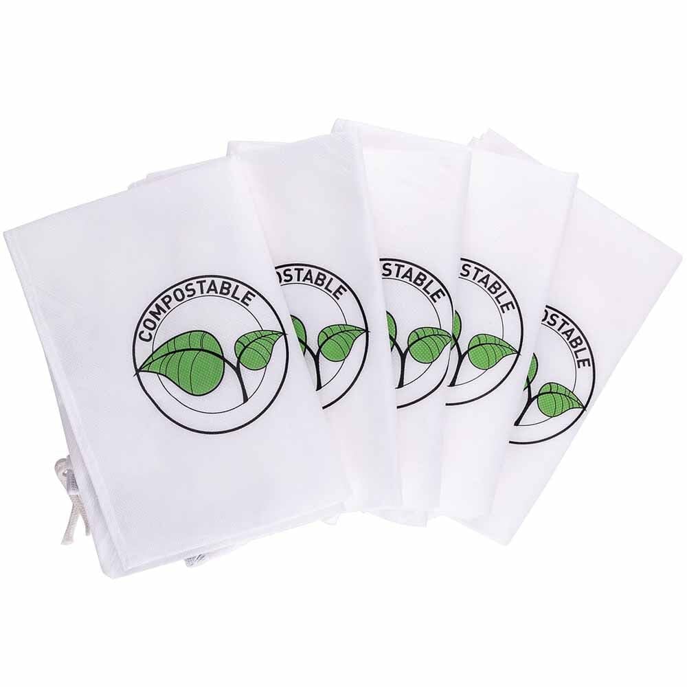 BV-008 disposable bags attached to Black+Decker blower vac for efficient yard cleanup.