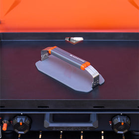 Blackstone 5987 OTG collapsible griddle press with folded handles for compact storage.