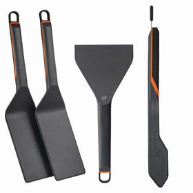Blackstone 8202 E-Series spatulas and tongs in use for precise flipping and serving.