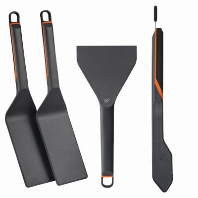 Blackstone 8202 E-Series spatulas and tongs in use for precise flipping and serving.