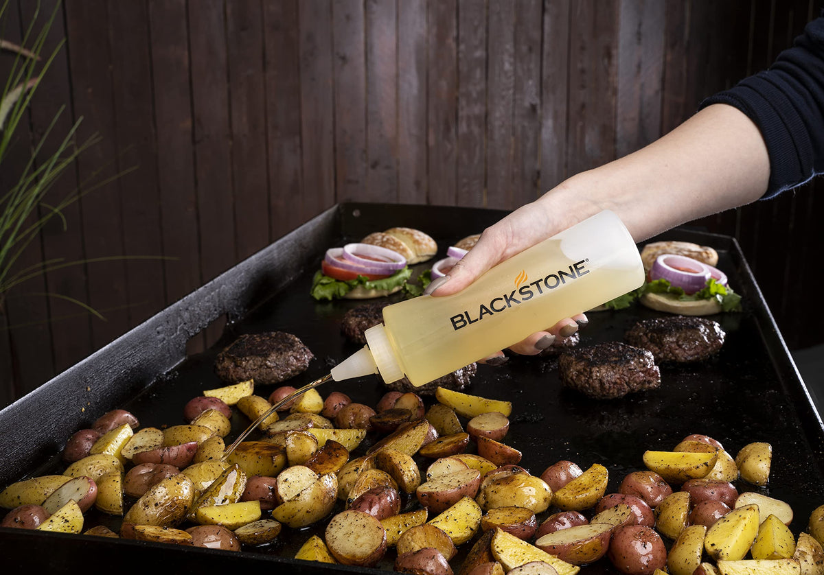 BLACKSTONE heavy-duty griddle scraper in action on flat top