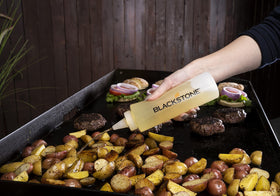 BLACKSTONE heavy-duty griddle scraper in action on flat top