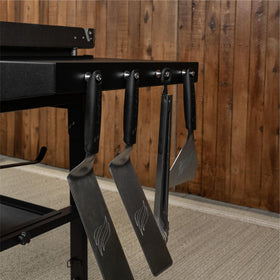Foldable legs and storage rack setup on the Blackstone Omnivore griddle, ready for transport.
