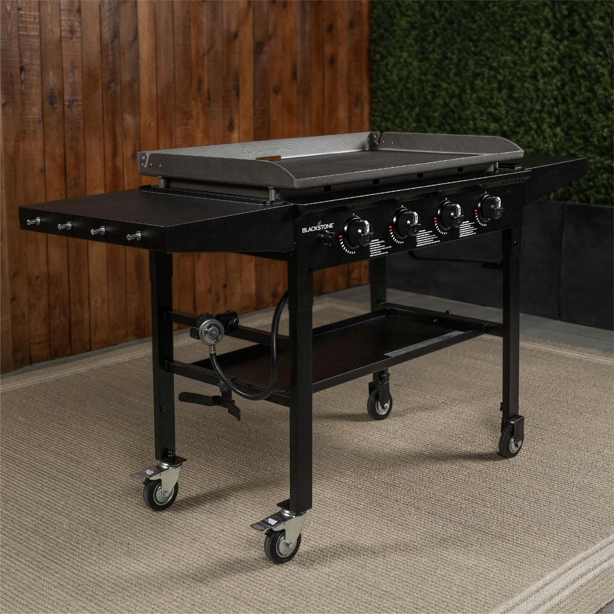 Outdoor kitchen setup featuring Blackstone 36-inch Omnivore Griddle on a patio.