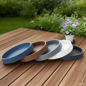 Bleuhome bird bath use — blue saucer doubles as garden decor