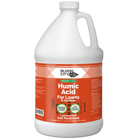 Bloom City Humic Acid bottle pouring into soil to support healthier lawn growth.
