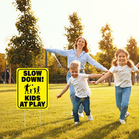 BLSUREFYX kids-at-play yellow sign highlights safety in neighborhoods.