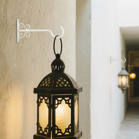 BOLITE wind chime hung securely on a wall hook for outdoor decor.