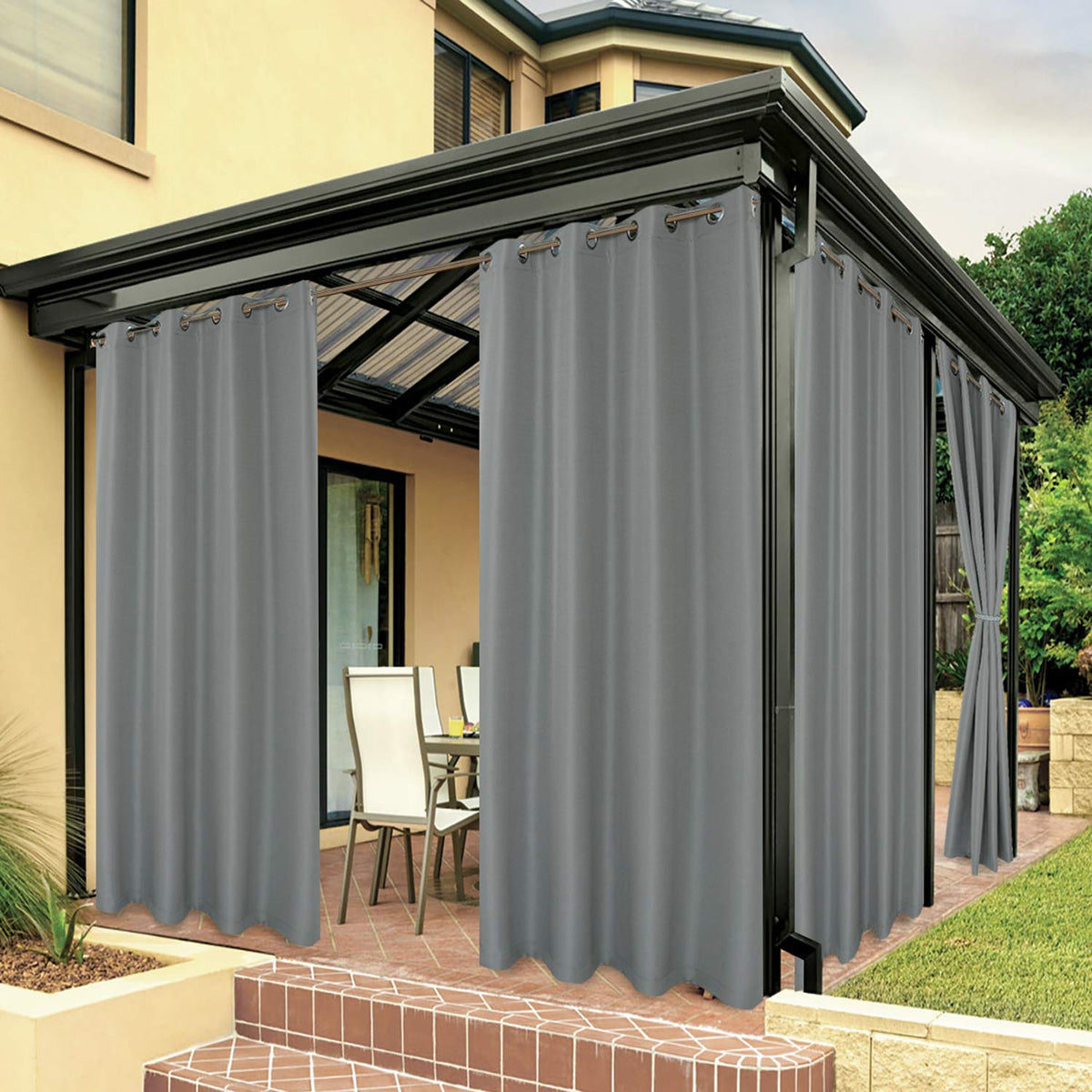 BONZER waterproof outdoor curtain on patio provides privacy and light control.