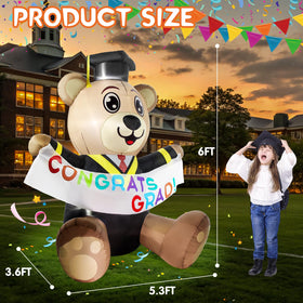 Boveco bear displays a CONGRATS GRAD banner for memorable photos.