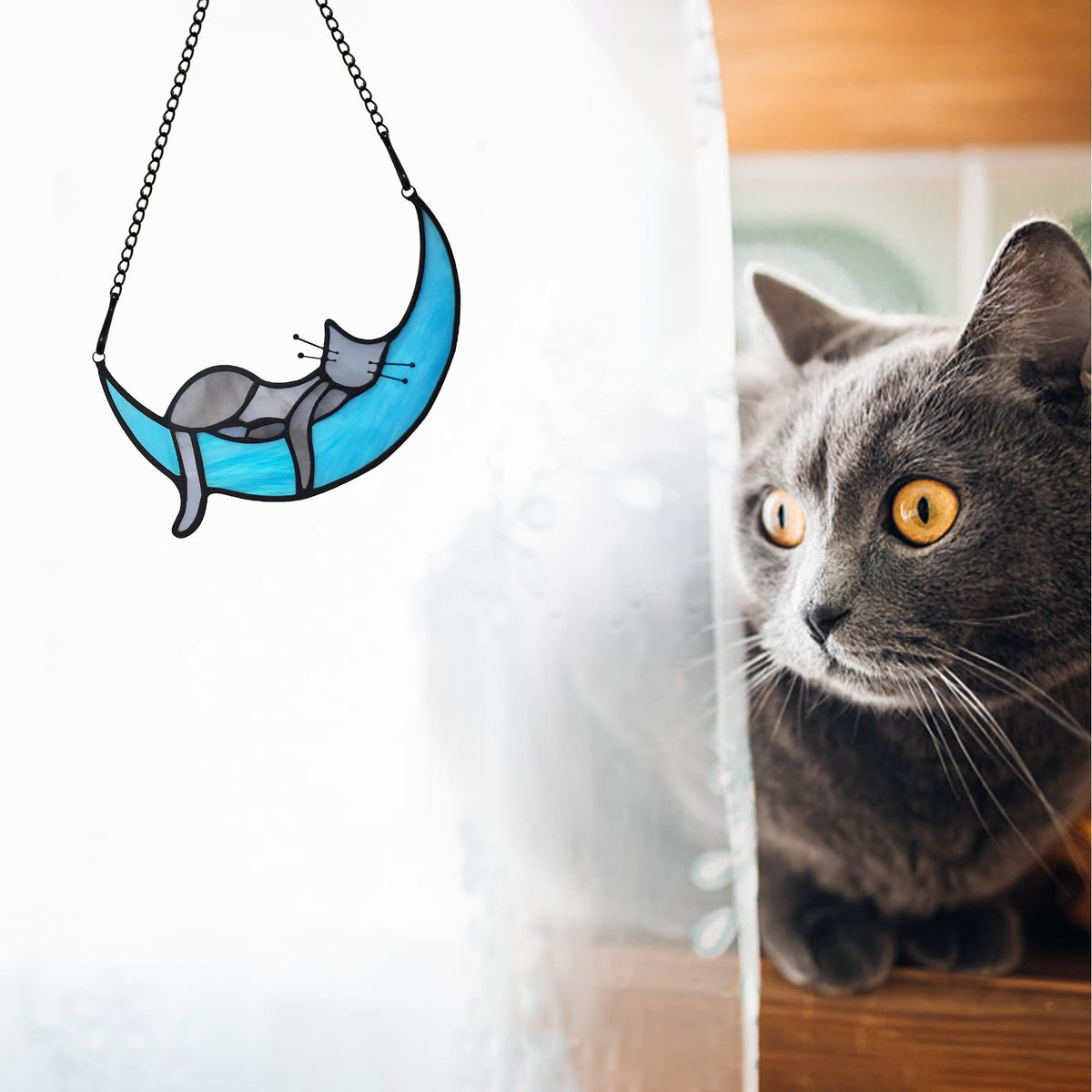 BOXCASA moon and cat suncatcher enhances shelves or windows with color and whimsy.