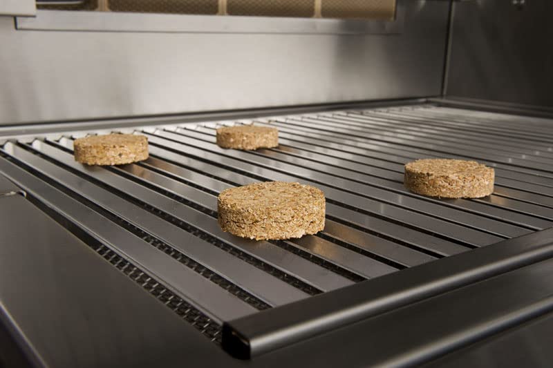 Close view of pecan bisquettes in burn chamber indicating clean, ash-free smoke.