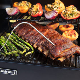 Probe connected to grill control panel for real-time temperature data