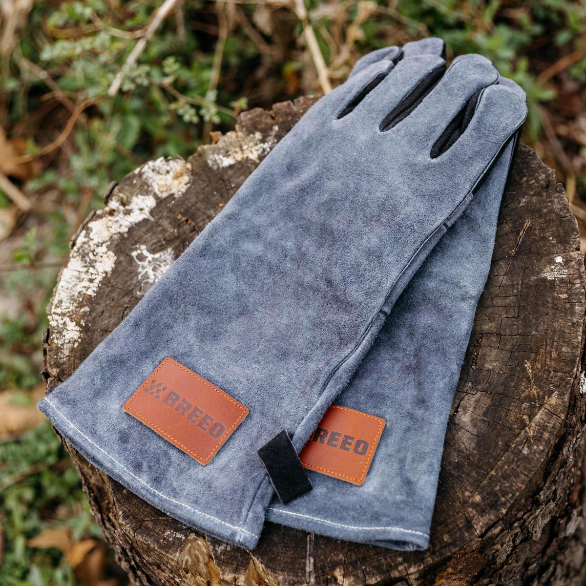 Breeo Fire Pit Gloves near flames highlighting heat protection.