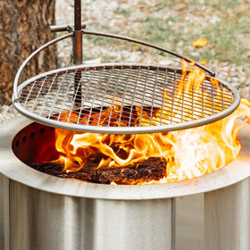 Breeo Outpost Grill 24 showing 360-degree rotation for even heating.