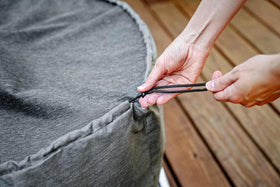 Breeo X Series 24-inch round fire pit cover side view for outdoor protection against the elements