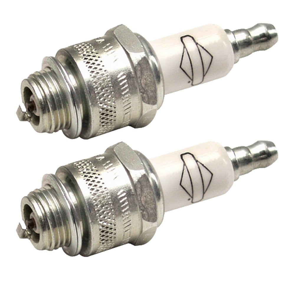 Briggs and Stratton spark plugs ready for installation beside packaging.