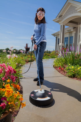 Briggs & Stratton surface cleaner cleans driveway and deck with rotating jets.