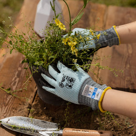 Brigic gloves with latex-coated grip enhancing tool hold in damp soil.