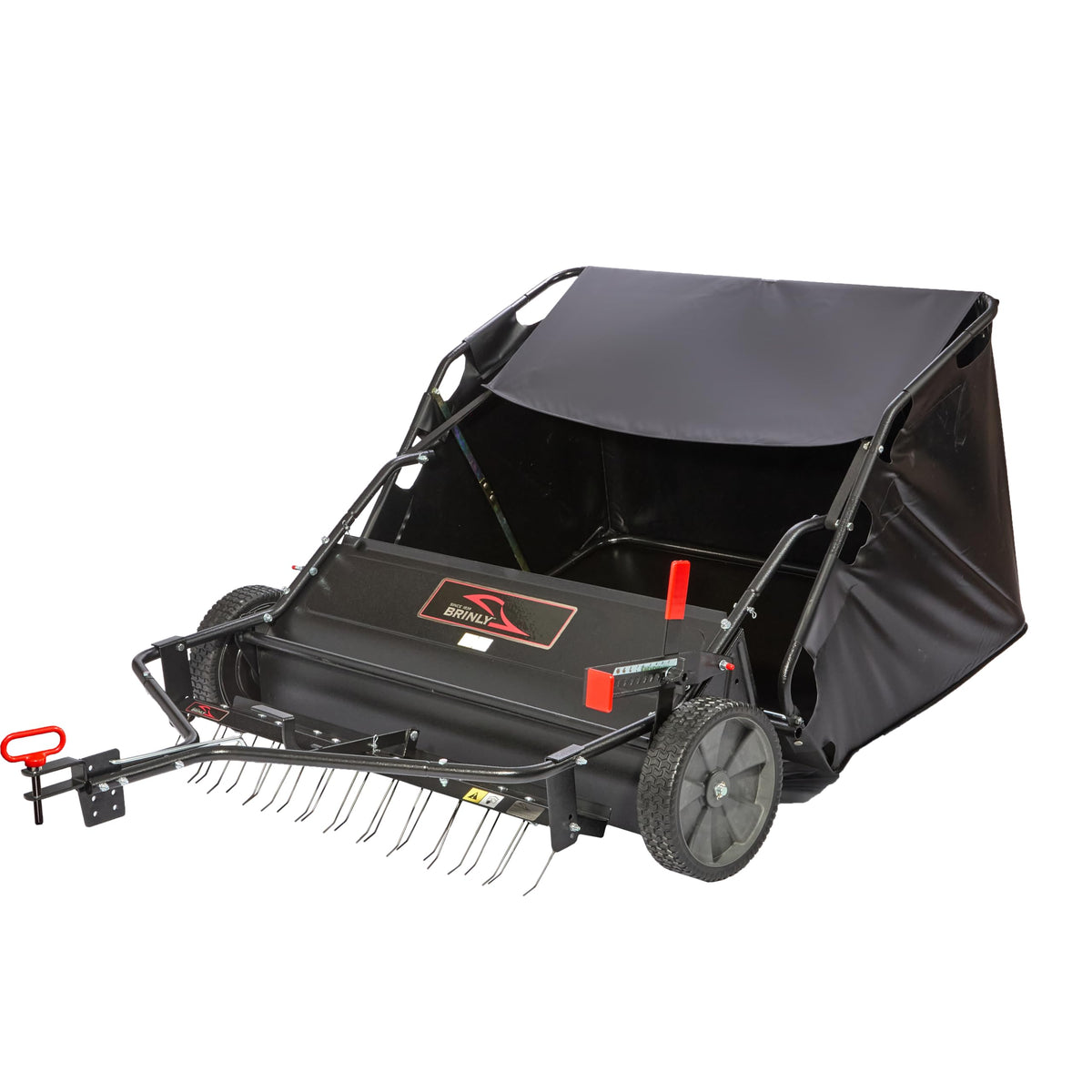 Brinly dethatcher attachment in use for thatch removal while sweeping