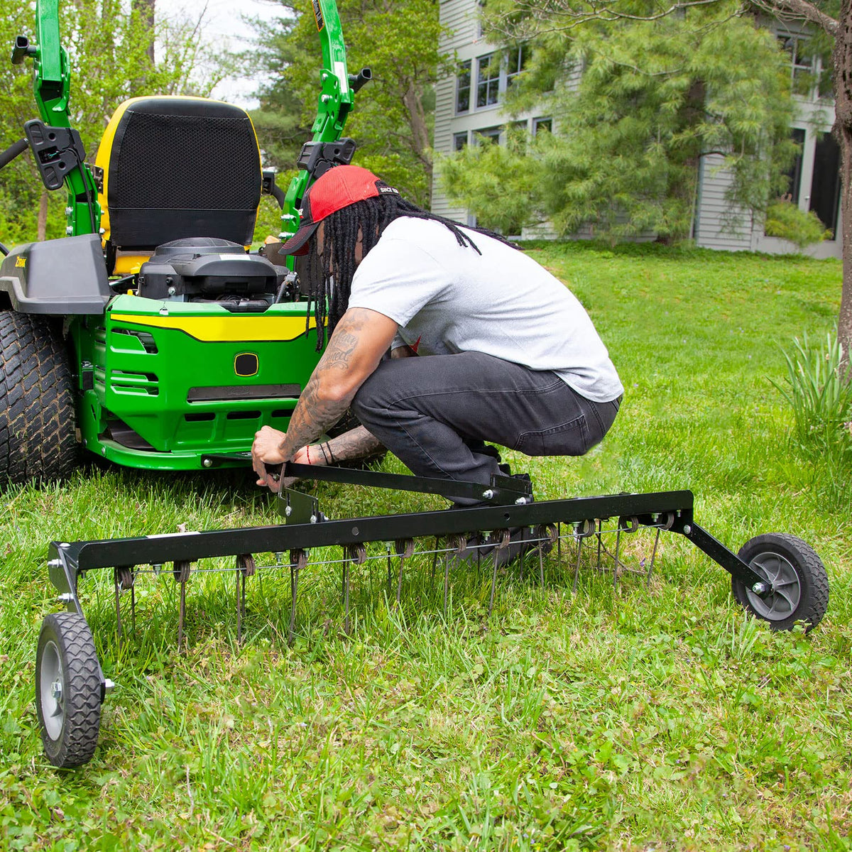 Brinly dethatcher two-row tines ensure thorough thatch removal across grass