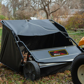 Brinly side view in use demonstrates sweeping effectiveness