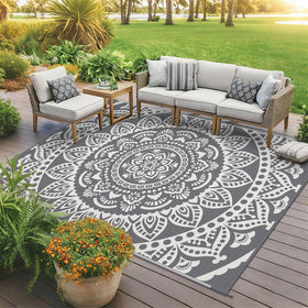 Bsmathom portable rug folds with carry bag for travel and camping.