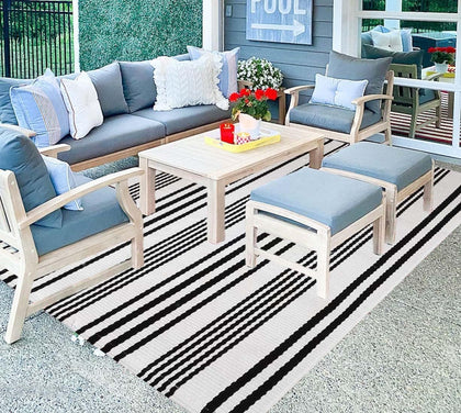 BUAGETUP black and white striped outdoor rug for patio decor.
