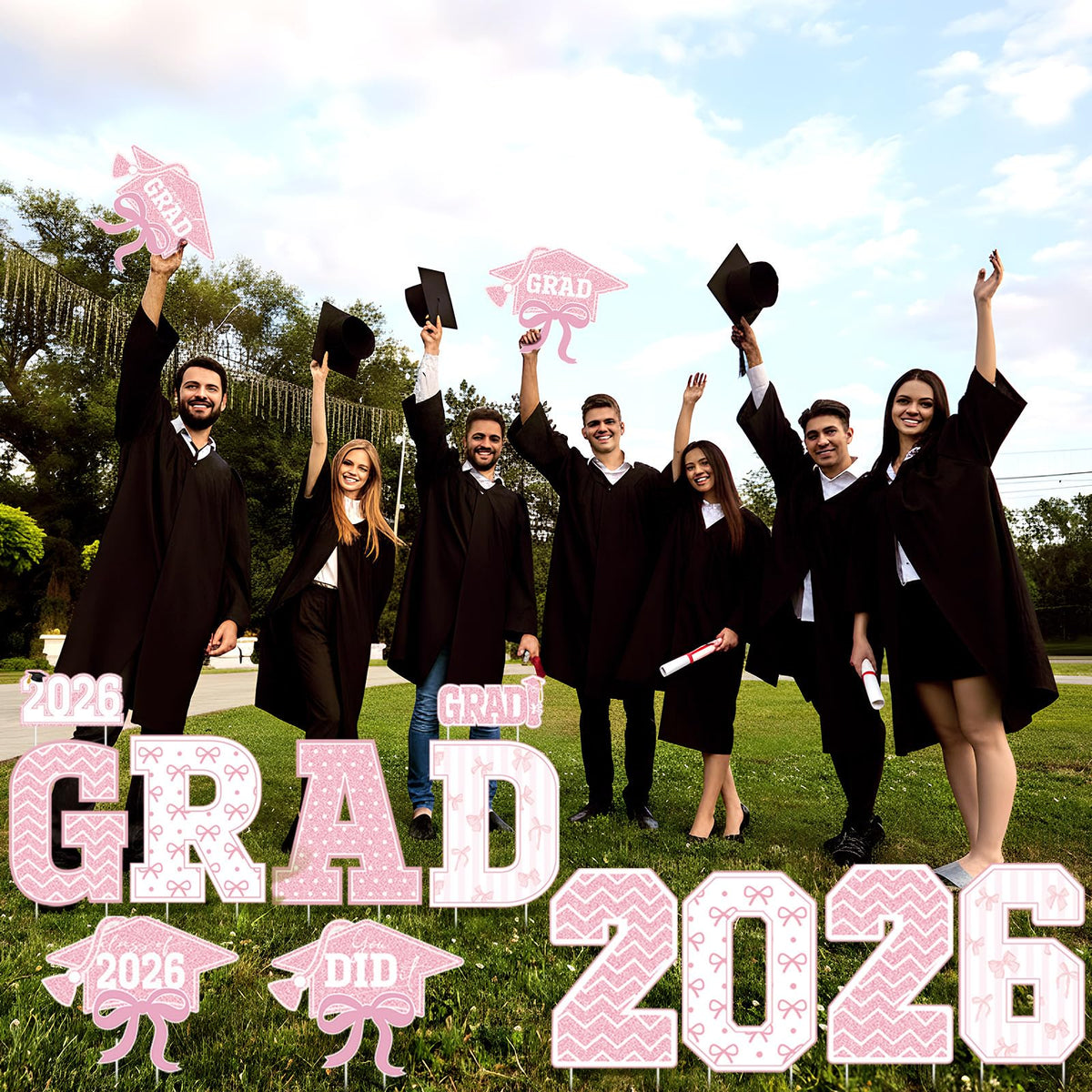 Bucherry pink bow decoration sign brings festive color to outdoor graduation celebrations.