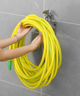 Multi-use organizer ideal for outdoor hoses and extension cords.