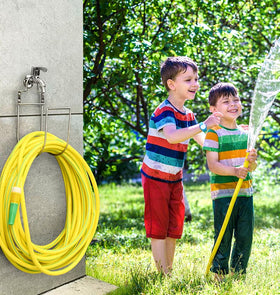Wall-mounted storage keeps water hose neatly coiled and protected.