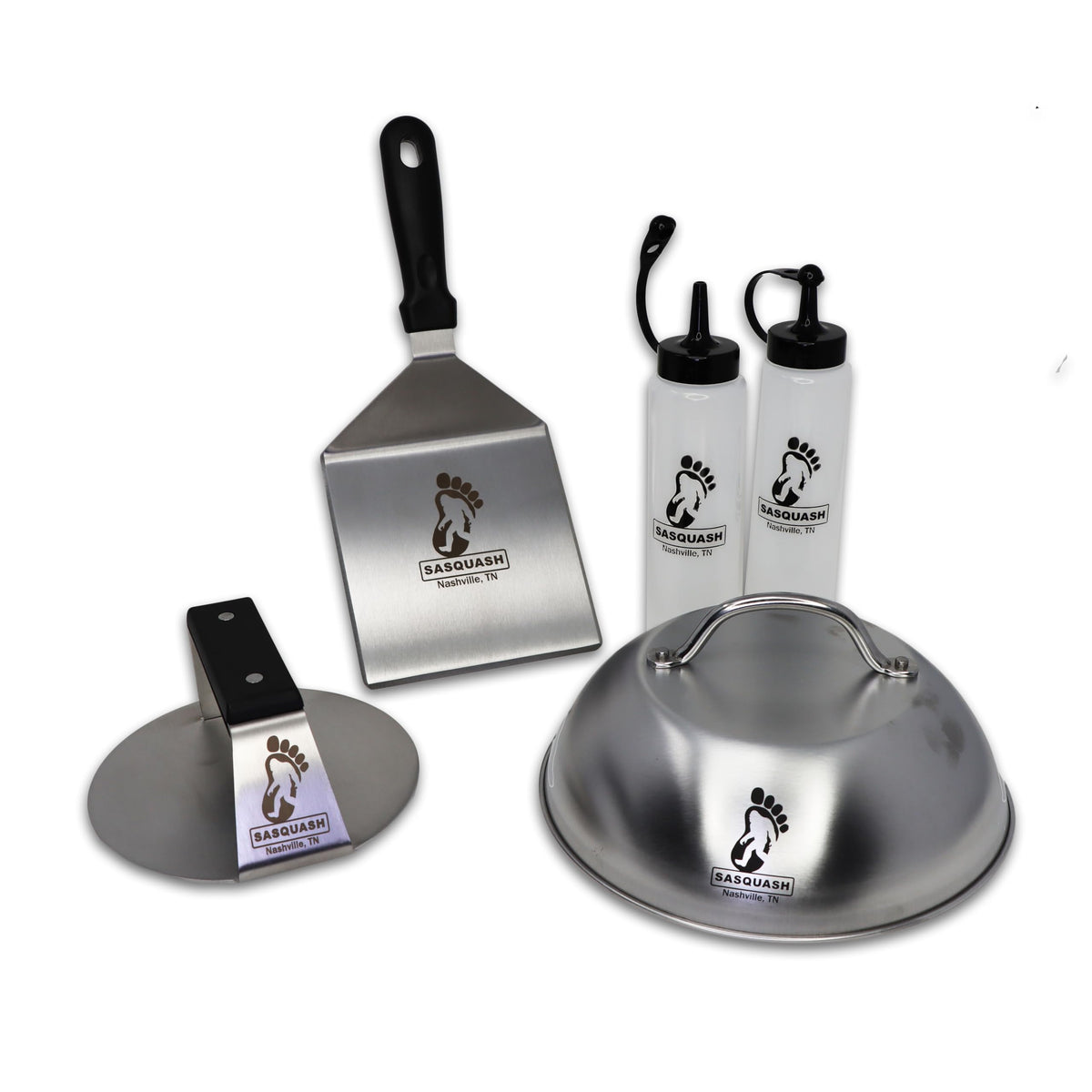 Burger Iron wide stainless spatula ready to flip burgers evenly.