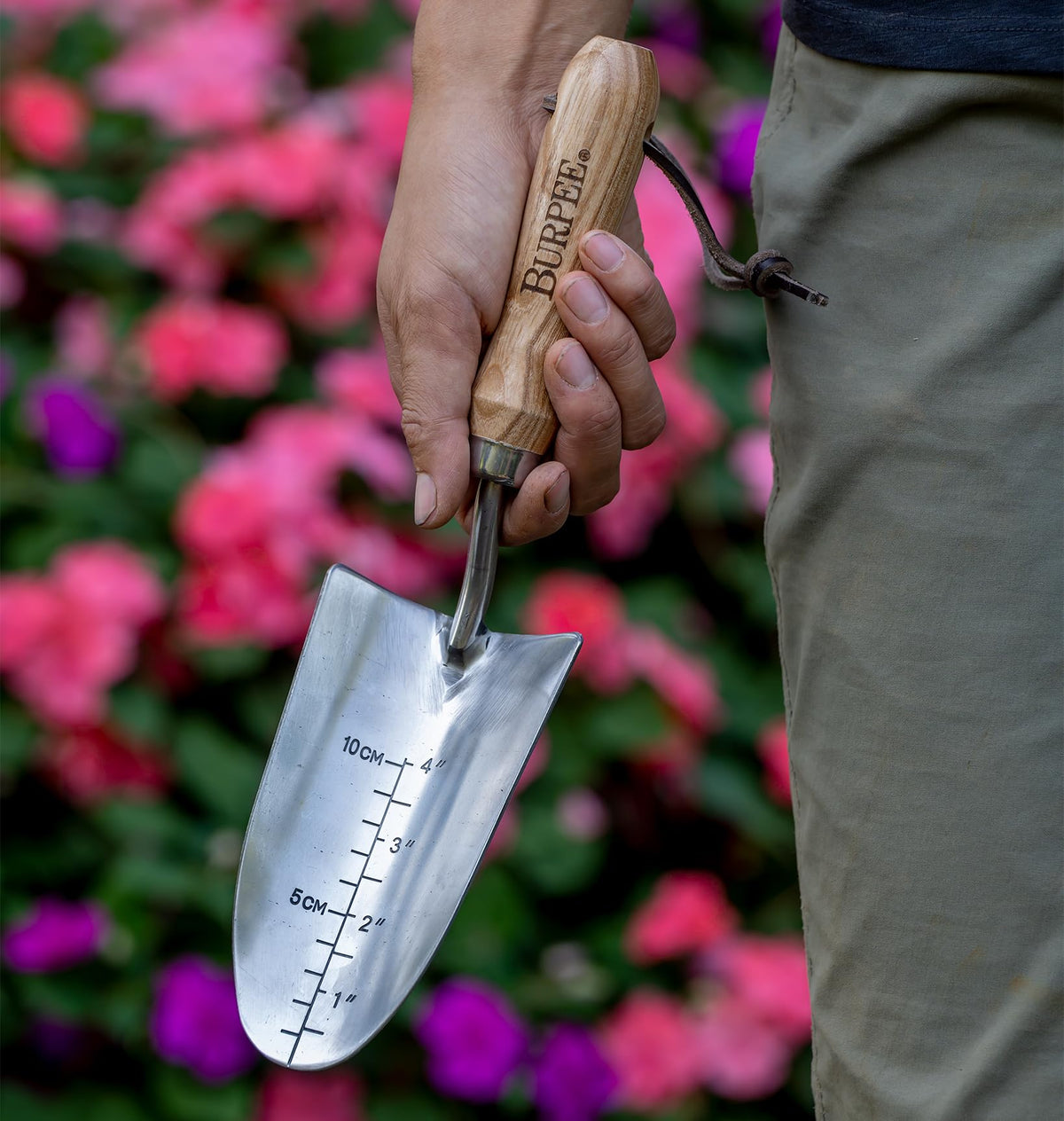 Burpee 13-inch trowel in use for precise digging and planting.