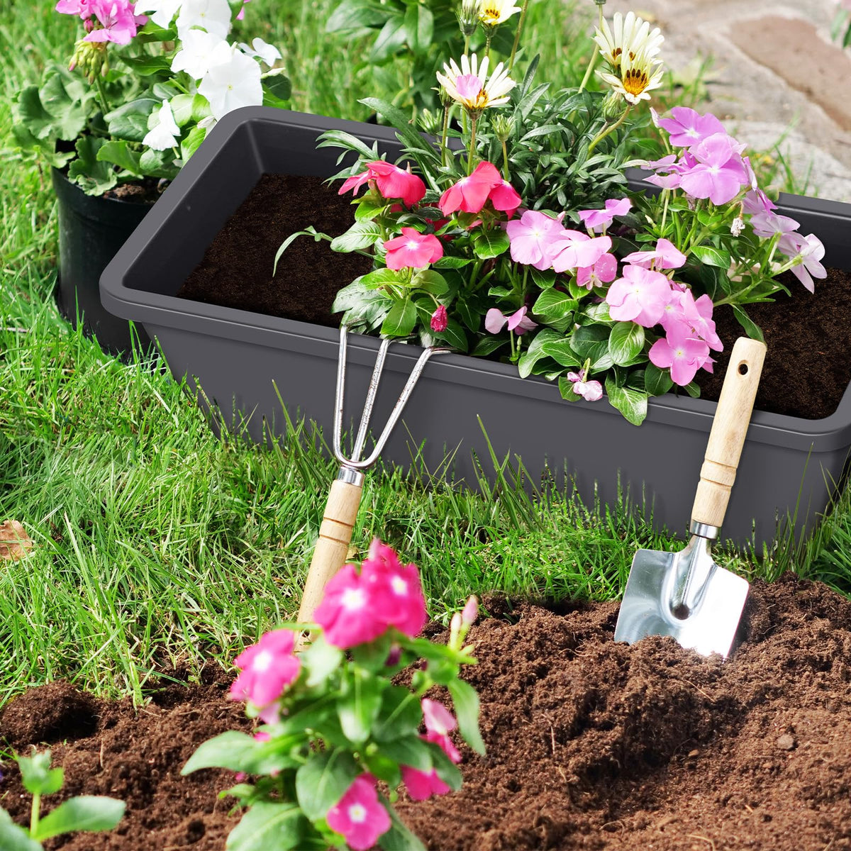 CADUKE railing planter boxes water tray and drainage holes in use for moisture control.