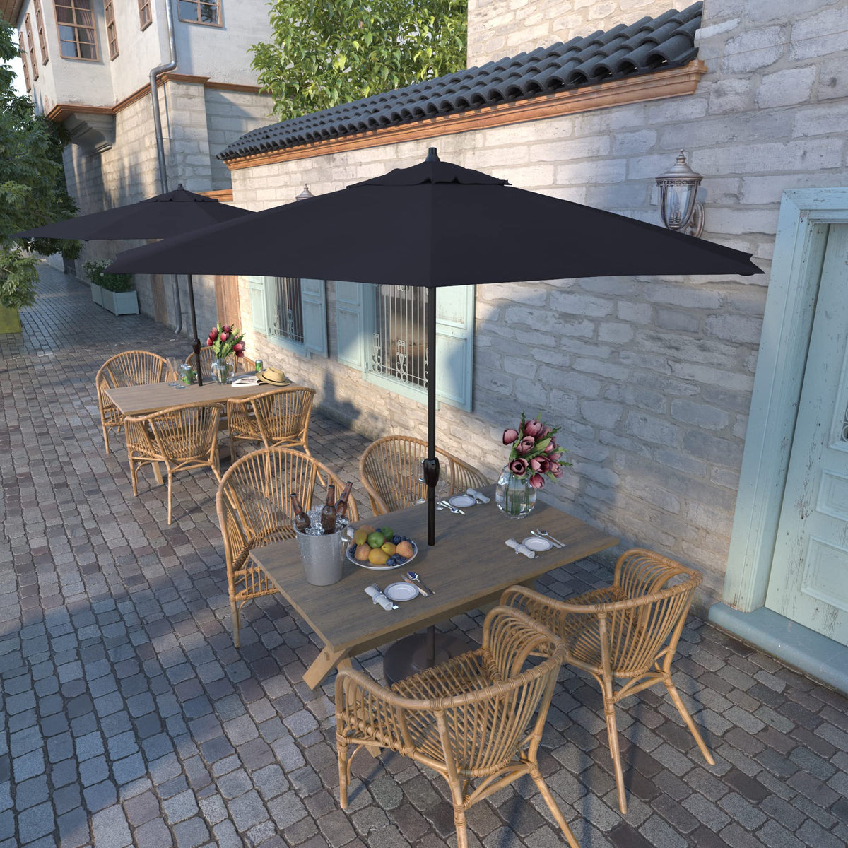 California Umbrella auto-tilt crank mechanism shown with bronze pole for easy shade control.