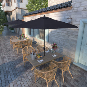 California Umbrella auto-tilt crank mechanism shown with bronze pole for easy shade control.