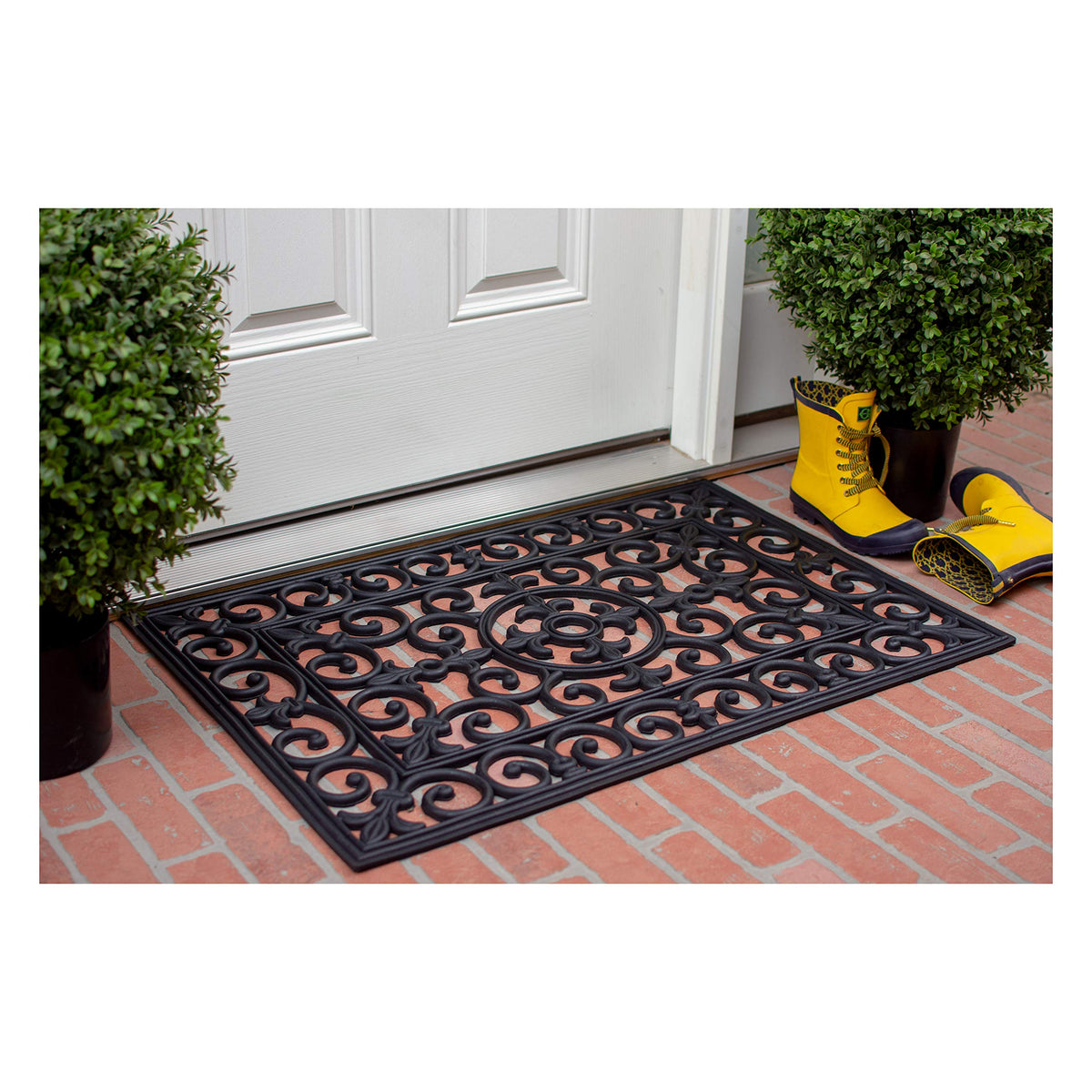 Calloway Mills Fleur De Lis mat placed at doorway showing all-season durability