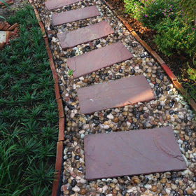 Calofulston river rocks offer natural color variety for garden decor.