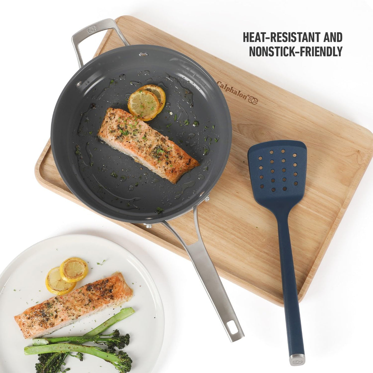Calphalon Edge silicone slotted turner navy drains liquids while lifting pancakes and salmon.