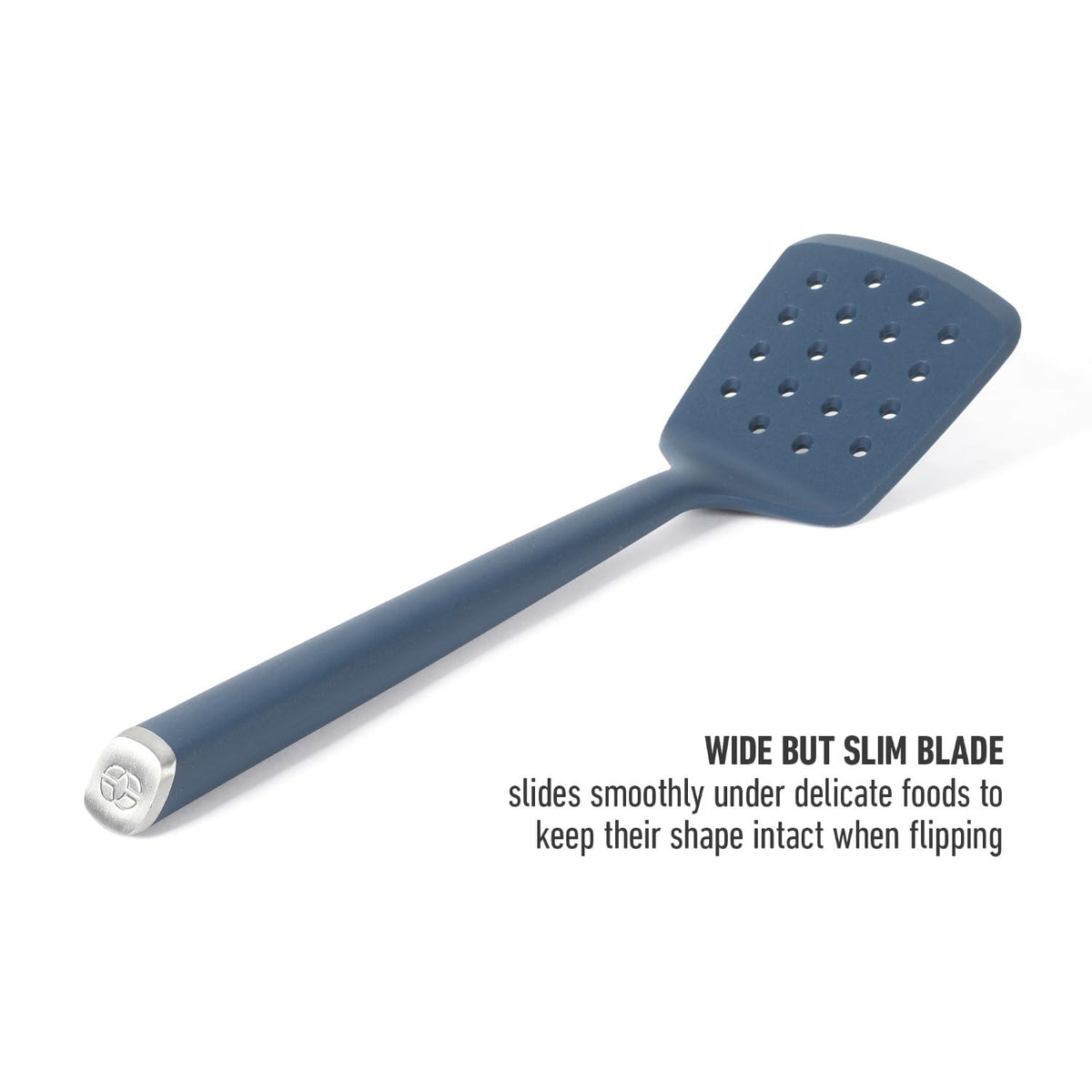 Calphalon Edge silicone turner navy perforations for draining while serving.