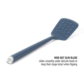 Calphalon Edge silicone turner navy perforations for draining while serving.