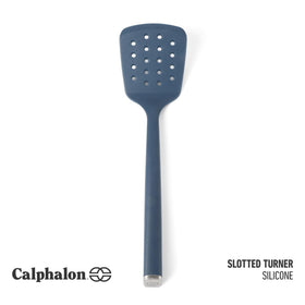 Calphalon Edge silicone turner navy handles nonstick surfaces safely while flipping.