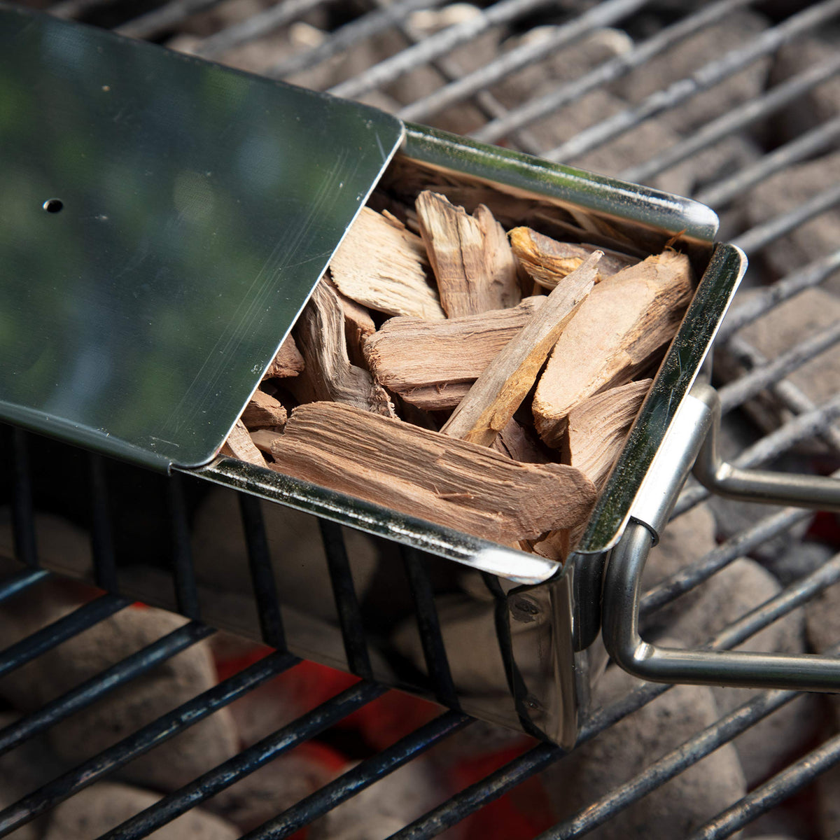 Camerons maple wood chips for grill setup with smoker box evokes backyard BBQ.