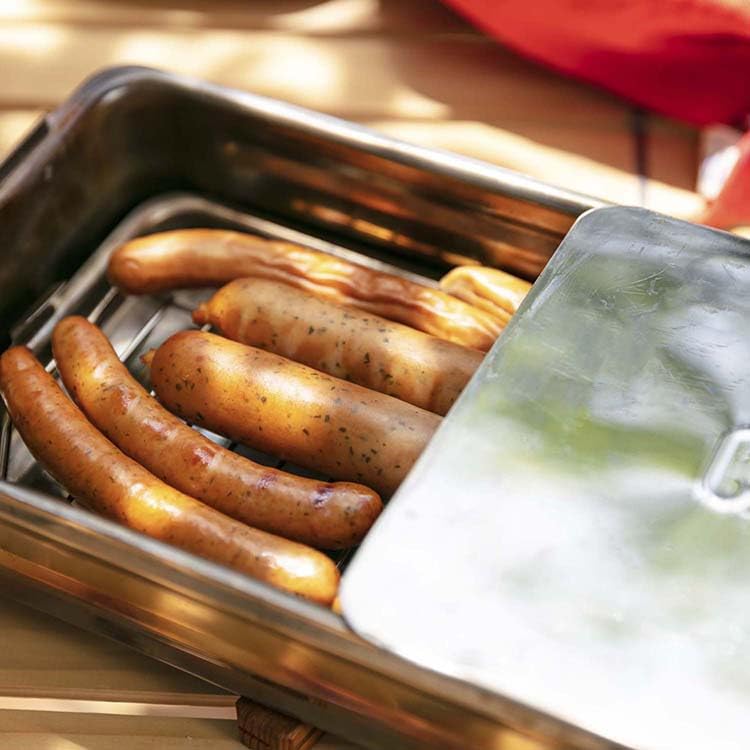Interior view showing the stick-free rack and drip pan for even smoke distribution