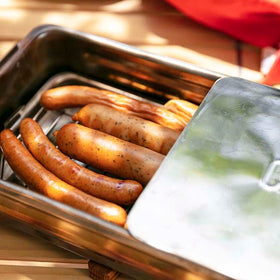Interior view showing the stick-free rack and drip pan for even smoke distribution