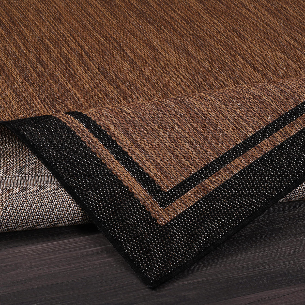 CAMILSON deck rug in nut brown and black border for outdoor living spaces