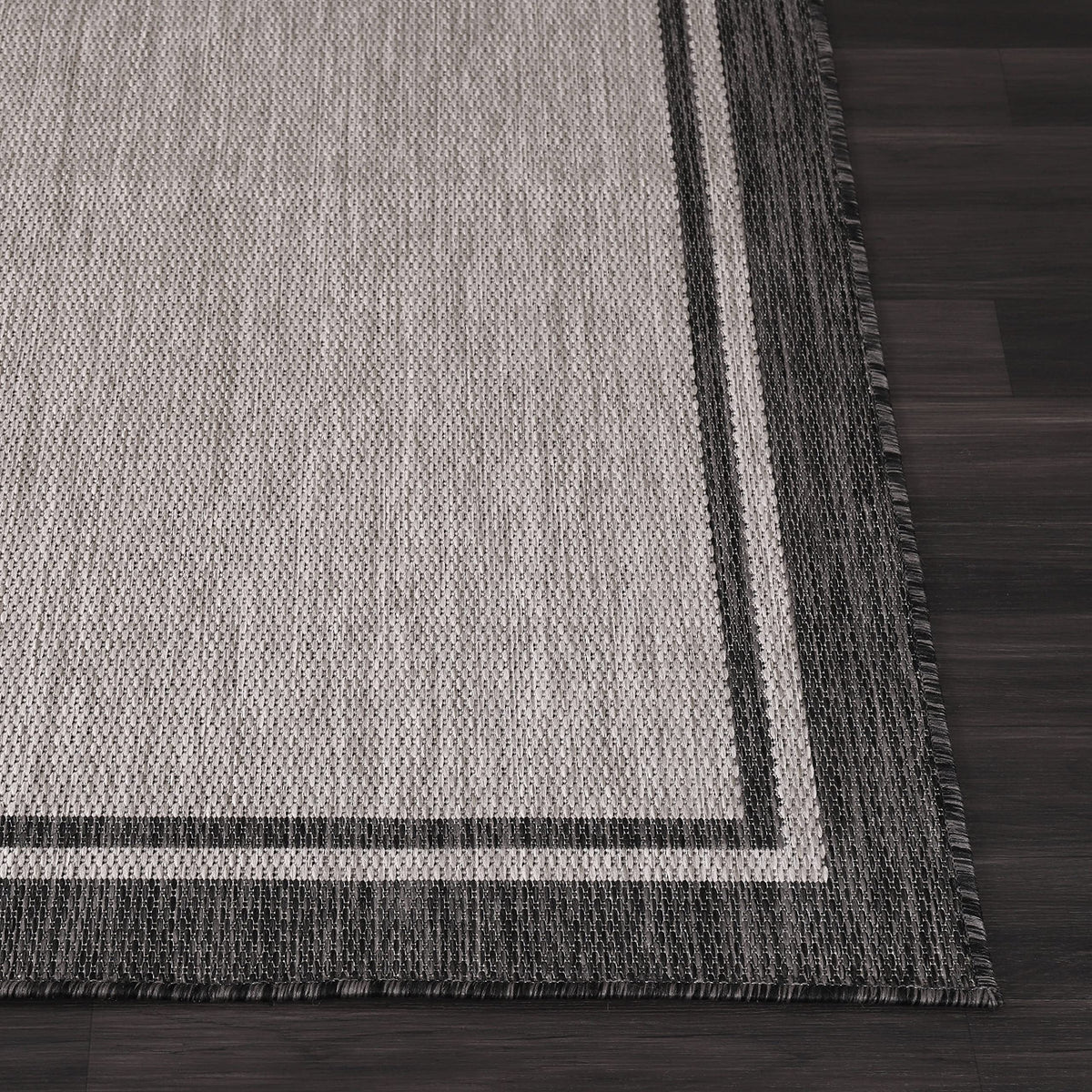 CAMILSON grey bordered rug complements modern home decor and palettes.