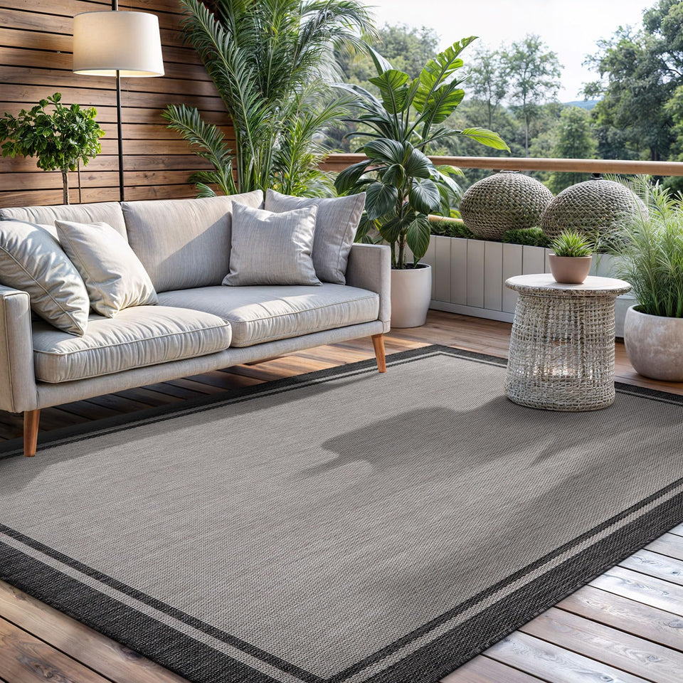 CAMILSON indoor outdoor rug bordered grey 5x7 enhances porch style and durability.