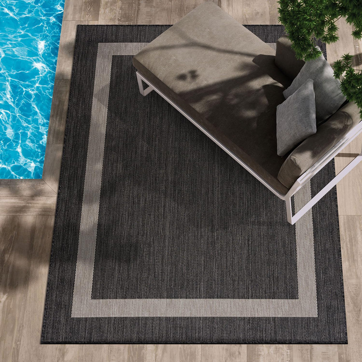CAMILSON outdoor rug with dark gray border offers durable patio style and easy cleaning.